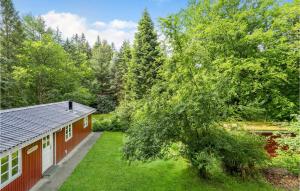 an overhead view of a red house with a yard at Stunning Home In Gistrup With Wifi in Gistrup