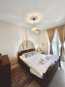 a bedroom with a large bed in a room at Villa Merci Budva in Budva