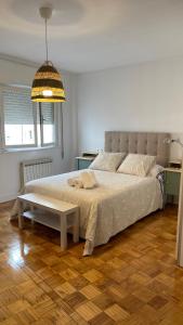 Ein Bett oder Betten in einem Zimmer der Unterkunft Apartamento Hórreo -San Pelayo-
