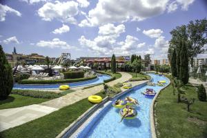 a group of people tubing down a lazy river at Apart hotel Gallery L in Sunny Beach