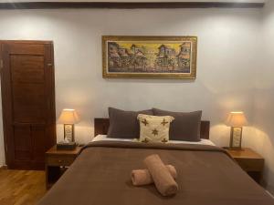 Postel nebo postele na pokoji v ubytování Kepaon Gari Inn