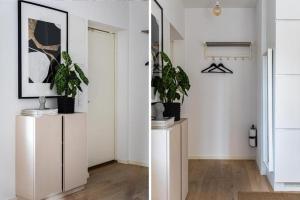 a hallway with potted plants on top of cabinets at Beautiful and modern accommodation near Stockholm City in Stockholm