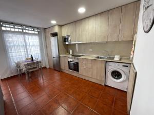 Kuchyň nebo kuchyňský kout v ubytování Apartamento SLAM