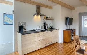 a kitchen with a counter top in a room at Nice Apartment In Østermarie With Wifi in Østermarie