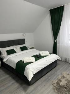 Ένα ή περισσότερα κρεβάτια σε δωμάτιο στο Alio Guest House