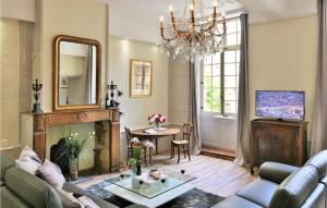 a living room with a couch and a fireplace at La Labrousse in Sarlat-la-Canéda +6 photos