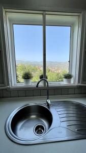 a kitchen sink in front of a window at Casa Carmelita in Las Palmas de Gran Canaria