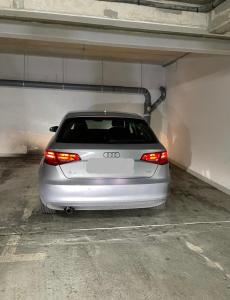 a silver car parked in a parking garage at Appartement idéalement placé in Villeparisis