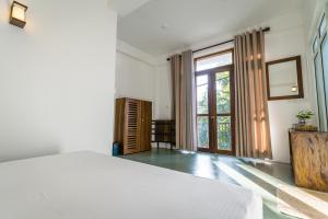 Postel nebo postele na pokoji v ubytování Atrium Hiriketiya + 37 fotografií
