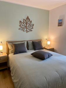 Un pat sau paturi într-o cameră la La Foglia