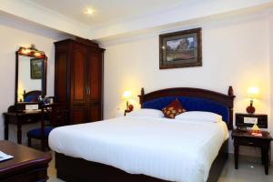 A bed or beds in a room at The Ruby Arena