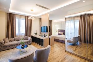 TV a/nebo společenská místnost v ubytování Gloria Palace Hotel & SPA