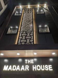 a sign that says the madarah house on a building at The Madaar House in Varanasi