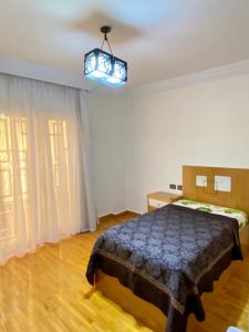 Ένα ή περισσότερα κρεβάτια σε δωμάτιο στο Tiba gardens - men only