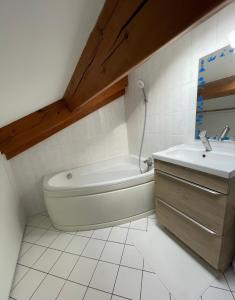 a white bathroom with a tub and a sink at Villa jacuzzi à 10min dAix en Pce in Gardanne