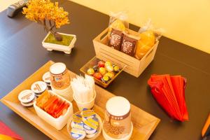 a table with a tray of food and fruits on it at B&B Da Nina Venice in Venice