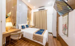 Kama o mga kama sa kuwarto sa SUNRISE Hotel Bạc Liêu