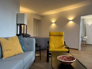 a living room with a couch and a table at Fi-Eck Apartments in Waldeck