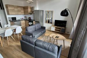 Kuchyňa alebo kuchynka v ubytovaní Bel Appart' 3 chambres 3 Sdb au centre-ville St Etienne