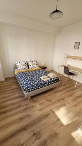 Posteľ alebo postele v izbe v ubytovaní Bel Appart' 3 chambres 3 Sdb au centre-ville St Etienne