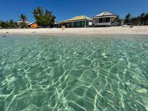 a view of the water in front of a beach at Home Stay Ramli in Bira