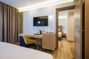 Postel nebo postele na pokoji v ubytování Gloria Palace Hotel & SPA