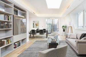 a living room with a couch and a table at Covent Garden Luxury Apartment in London