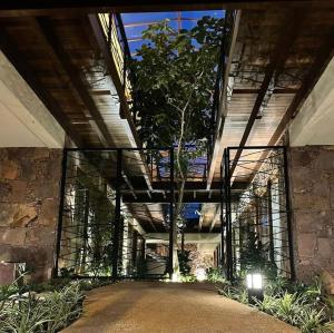 a large building with a tree inside of it at Villa Andorinha, Apt 03 in Mucugê