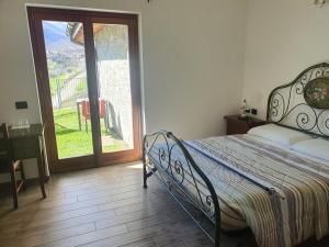Postel nebo postele na pokoji v ubytování Agriturismo Nona Rosa