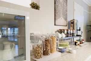 a display of food items on a shelf in a store at Hurtwood Hotel in Peaslake