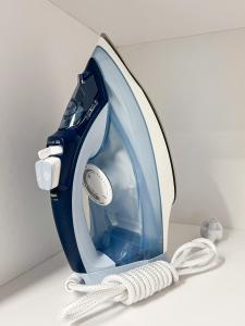 a blue and white iron sitting on a counter at Apartamenty LUNA in Świeradów-Zdrój