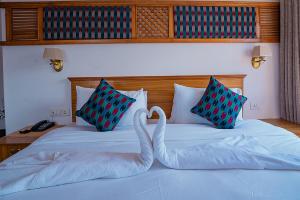 Postel nebo postele na pokoji v ubytování Himalayan Glory Inn