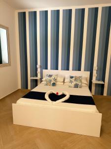 A bed or beds in a room at Casa Onofrio Tropea