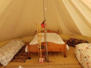 a bedroom with two beds in a tent at The Meadows Bell Tents in Clare