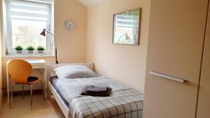 Postel nebo postele na pokoji v ubytování Ferienwohnung Im Grünen