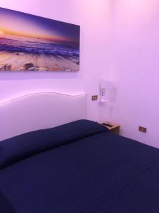 Postel nebo postele na pokoji v ubytování Hotel Vietri Coast