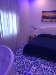 Postel nebo postele na pokoji v ubytování Hotel Vietri Coast