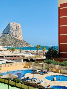 a view of a resort with a mountain in the background at Amatista 11 a in Calpe