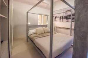 a bedroom with a bed with a metal frame at Piazza di Spagna 9 in Rome