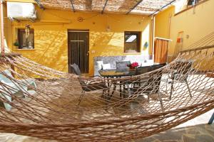 a hammock in the courtyard of a house at Antica Cefalu' in Cefalù