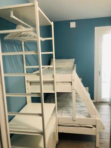A bed or beds in a room at Opalia Residence - Stella Garda Lake Lifestyle Még 37 kép