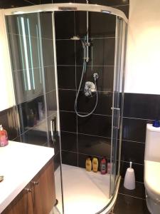 a shower with a glass door in a bathroom at Willow Lodge , Corskie Drive Macduff-Banff in Macduff