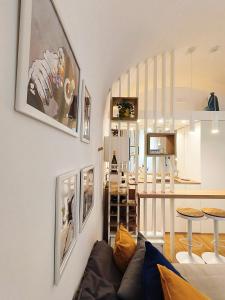 a living room with a couch and a dining room at IN URBS in Salerno