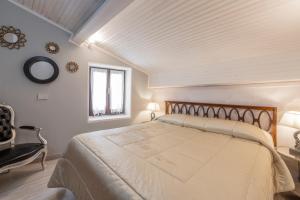 เตียงในห้องที่ Rustico Terra Cielo - renovated in 2023