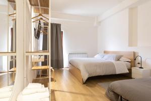 Postel nebo postele na pokoji v ubytování B&B La Camia
