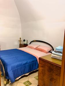Säng eller sängar i ett rum på Totaro Casa Vacanze