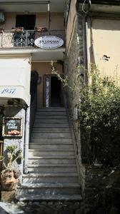 a stairway leading up to a building with a sign on it at affittacamere la loggia in Levanto