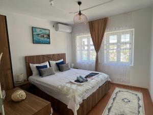 a bedroom with a large bed and a window at Guesthouse Maritimo in Ulcinj
