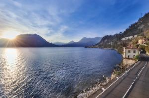 a view of a lake with mountains in the background at Margherita House in Varenna