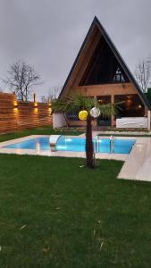 a swimming pool in front of a house at palace_sapanca in Sapanca